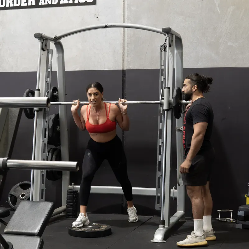 Members on the smith machine at Kaos Fitness