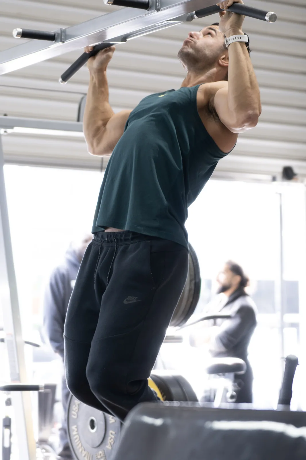 Athlete performing pull-ups during athletic development training